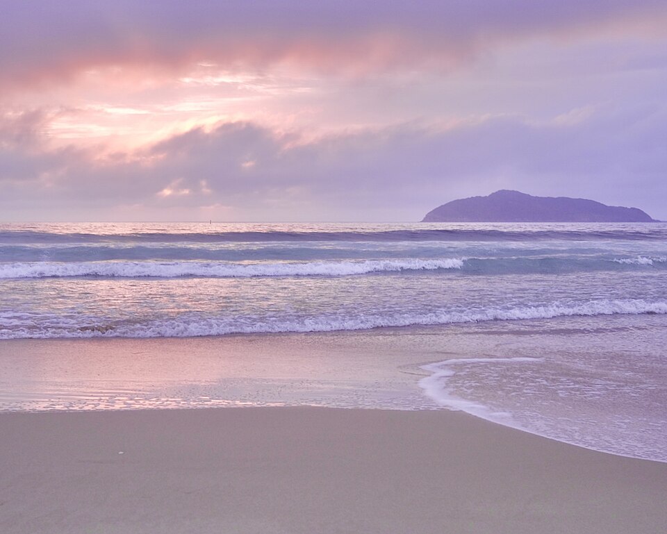 Pink sunrise over the surf at Bennetts Beach, Hawks Nest, near Tea Gardens